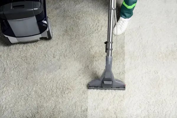 high-angle-view-of-person-cleaning-white-carpet-v2